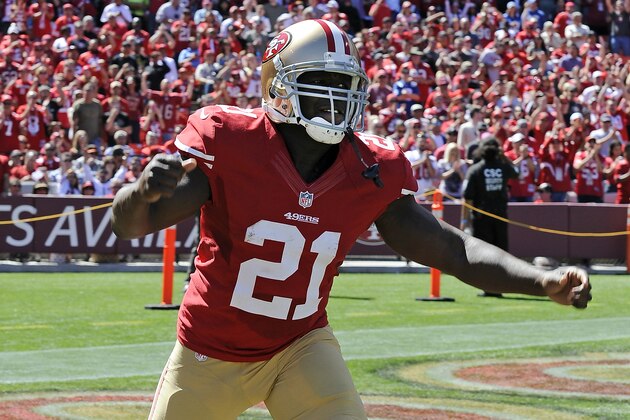 San Francisco 49ers running back Frank Gore (21) runs on the field for player introductions before a game against the Indianapolis Colts played at Candlestick Park in San Francisco on Sunday, September 22, 2013. (AP Photo/John Cordes)