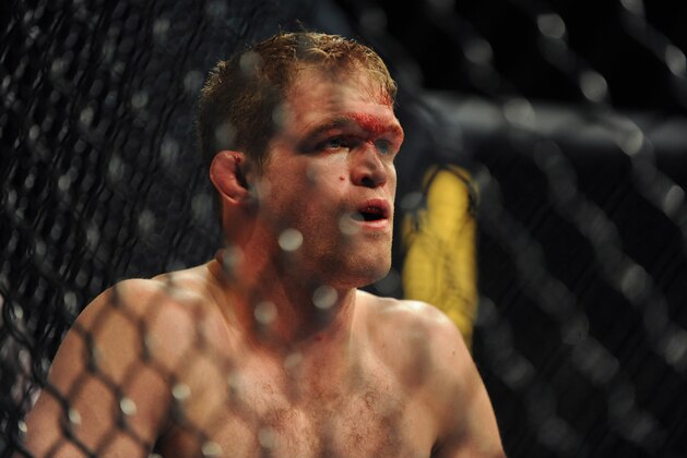 Nov 16, 2013; Las Vegas, NV, USA; Evan Dunham (blue gloves) reacts after losing his lightweight bout during UFC 167 at MGM Grand Garden Arena. Mandatory Credit: Stephen R. Sylvanie-USA TODAY Sports