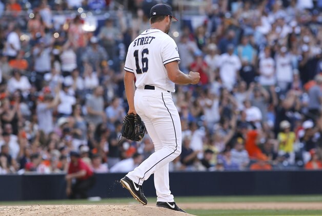 San Diego Padres relief pitcher Huston Street pumps his fist after getting the last out of a baseball game against the San Francisco Giants in the ninth inning on Friday, July 4, 2014, in San Diego. San Diego won the game 2-0. (AP Photo/Don Boomer)