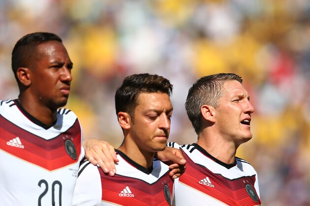 RIO DE JANEIRO, BRAZIL - JULY 04: (L-R) Jerome Boateng, Mesut Oezil and Bastian Schweinsteiger of Germany sing the National Anthem prior to the 2014 FIFA World Cup Brazil Quarter Final match between France and Germany at Maracana on July 4, 2014 in Rio de Janeiro, Brazil. (Photo by Julian Finney/Getty Images) RIO DE JANEIRO, BRAZIL - JULY 04: (L-R) Jerome Boateng, Mesut Oezil and Bastian Schweinsteiger of Germany sing the National Anthem prior to the 2014 FIFA World Cup Brazil Quarter Final match between France and Germany at Maracana on July 4, 2014 in Rio de Janeiro, Brazil. (Photo by Julian Finney/Getty Images)
