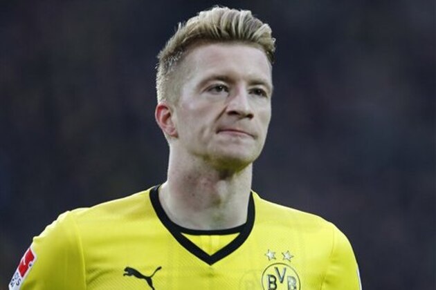 Dortmund's Marco Reus celebrates after scoring  during the German first division Bundesliga soccer match between Borussia Dortmund and Hertha BSC Berlin in Dortmund , Germany, Saturday, Dec. 21, 2013. (AP Photo/Frank Augstein)