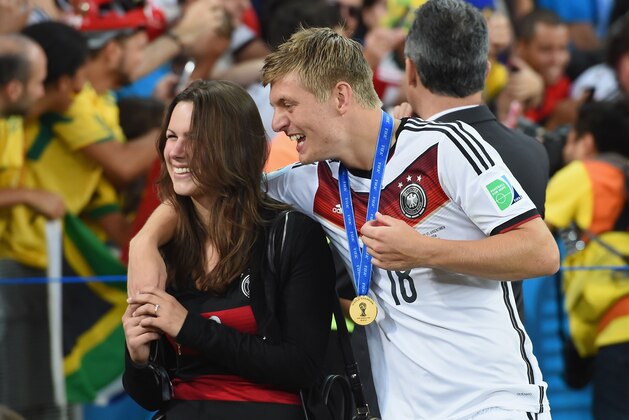 RIO DE JANEIRO, BRAZIL - JULY 13:  Toni Kroos of Germany celebrates with girlfriend Jessica Farber after defeating Argentina 1-0 in extra time during the 2014 FIFA World Cup Brazil Final match between Germany and Argentina at Maracana on July 13, 2014 in Rio de Janeiro, Brazil.  (Photo by Matthias Hangst/Getty Images)