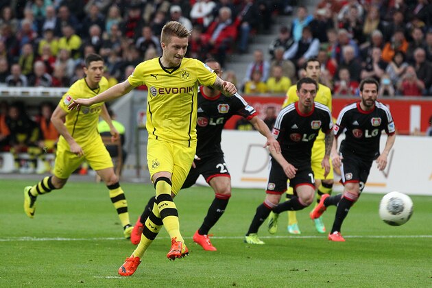 Dortmund's Marco Reus scores his side's equalizing goal by penalty during a German Bundesliga soccer match between Bayer 04 Leverkusen and Borussia Dortmund in Leverkusen, Germany, Saturday, April 26, 2014. (AP Photo/Michael Probst)