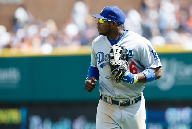 Jul 9, 2014; Detroit, MI, USA; Los Angeles Dodgers right fielder Yasiel Puig (66) runs off the field against the Detroit Tigers at Comerica Park. Mandatory Credit: Rick Osentoski-USA TODAY Sports