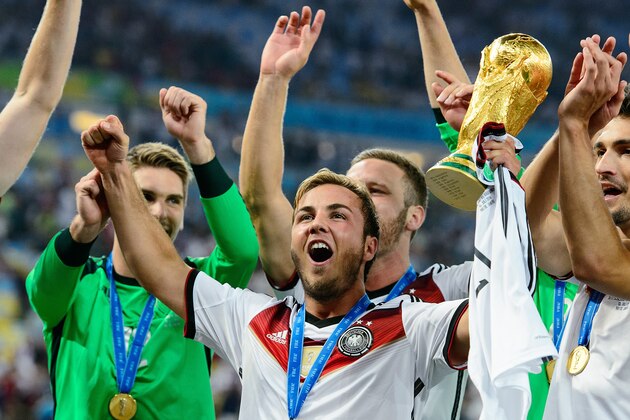 RIO DE JANEIRO, BRAZIL - JULY 13: Mario Goetze celebrate with the World Cup trophy after defeating Argentina 1-0 in extra time during the 2014 FIFA World Cup Brazil Final match between Germany and Argentina at Maracana on July 13, 2014 in Rio de Janeiro, Brazil. (Photo by Matthias Hangst/Getty Images) RIO DE JANEIRO, BRAZIL - JULY 13: Mario Goetze celebrate with the World Cup trophy after defeating Argentina 1-0 in extra time during the 2014 FIFA World Cup Brazil Final match between Germany and Argentina at Maracana on July 13, 2014 in Rio de Janeiro, Brazil. (Photo by Matthias Hangst/Getty Images)