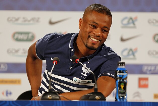 France's Patrice Evra smiles during  a press conference at the Teatro Pedro II, in Ribeirao Preto, Brazil, Wednesday, June 18, 2014. France plays in group E of the 2014 Brazil soccer World Cup. (AP Photo/David Vincent)