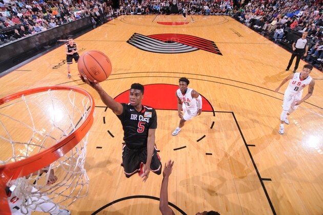 PORTLAND, OR - APRIL 12:  Emmanuel Mudiay #5 of the World Team drives to the basket against the USA Team on April 12, 2014 at the Moda Center Arena in Portland, Oregon. NOTE TO USER: User expressly acknowledges and agrees that, by downloading and or using this photograph, user is consenting to the terms and conditions of the Getty Images License Agreement. Mandatory Copyright Notice: Copyright 2014 NBAE (Photo by Sam Forencich/NBAE via Getty Images)