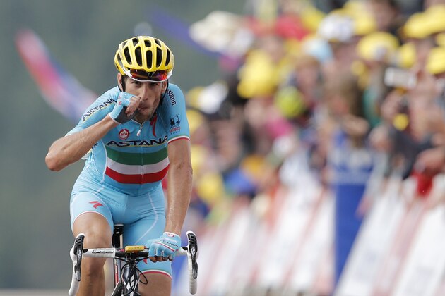 Italy's Vincenzo Nibali crosses the finish line to win the tenth stage of the Tour de France cycling race over 161.5 kilometers (100.4 miles) with start in Mulhouse and finish in La Planche des Belles Filles, France, Monday, July 14, 2014. (AP Photo/Peter Dejong)