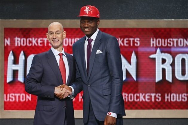 CORRECTS LAST NAME OF DAFTEE TO CAPELA - Clint Capela, right, of France, poses for photos with NBA Commissioner Adam Silver after being selected 25th overall by the Houston Rockets during the 2014 NBA draft, Thursday, June 26, 2014, in New York. (AP Photo/Jason DeCrow)
