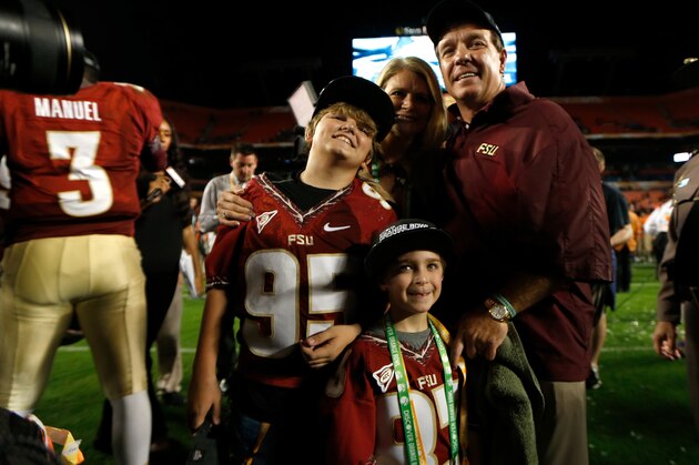 MIAMI GARDENS, FL - JANUARY 01:  Head coach Jimbo Fisher of the Florida State Seminoles poses with his wife Candi, and sons Trey (L) and Ethan as they celebrate after the Seminoles won 31-10 against the Northern Illinois Huskies during the Discover Orange Bowl at Sun Life Stadium on January 1, 2013 in Miami Gardens, Florida.  (Photo by Chris Trotman/Getty Images)
