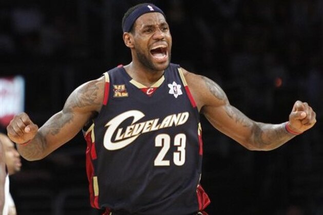 FILE - In this Dec. 25, 2009 file photo, Cleveland Cavaliers forward LeBron James reacts during the second half against the Los Angeles Lakers in an NBA basketball game in Los Angeles. James told Sports Illustrated on Friday, July 11, 2014, he is leaving the Miami Heat to go back to the Cleveland Cavaliers. (AP Photo/Lori Shepler, File)