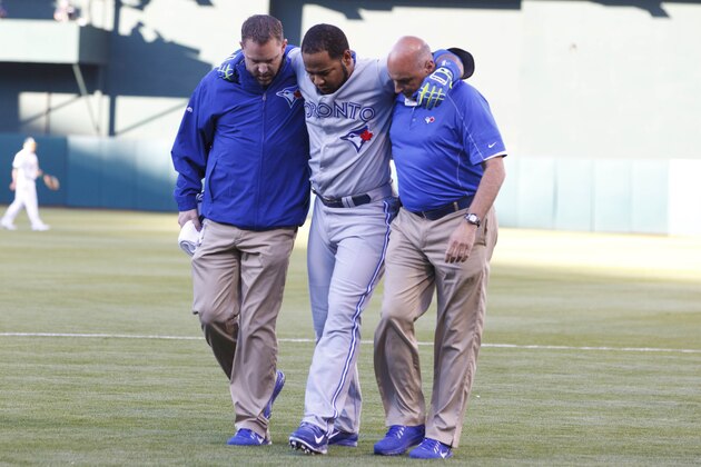 OAKLAND, CA - JULY 05: Edwin Encarnacion #10 of the Toronto Blue Jays is assisted off the field by trainers after sustaining an injury during the first inning against the Oakland Athletics at O.co Coliseum on July 5, 2014 in Oakland, California. (Photo by Jason O. Watson/Getty Images) OAKLAND, CA - JULY 05: Edwin Encarnacion #10 of the Toronto Blue Jays is assisted off the field by trainers after sustaining an injury during the first inning against the Oakland Athletics at O.co Coliseum on July 5, 2014 in Oakland, California. (Photo by Jason O. Watson/Getty Images)