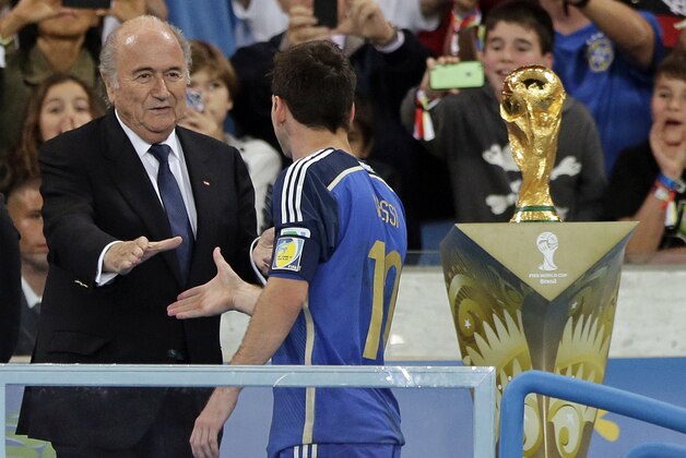 Argentina's Lionel Messi shakes hands with FIFA President Sepp Blatter after the World Cup final soccer match between Germany and Argentina at the Maracana Stadium in Rio de Janeiro, Brazil, Sunday, July 13, 2014. Germany won the match 1-0. (AP Photo/Matthias Schrader)
