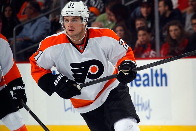 NEWARK, NJ - SEPTEMBER 26:  Scott Laughton #21 of the Philadelphia Flyers skates against the New Jersey Devils at the Prudential Center on September 26, 2013 in Newark, New Jersey. The Devils defeated the Flyers 4-1.  (Photo by Bruce Bennett/Getty Images)