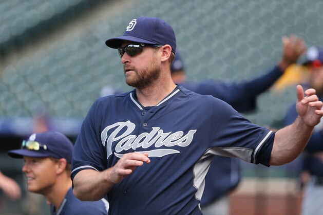 San Diego Padres third baseman Chase Headley warms up before facing the Colorado Rockies in the first inning of a baseball game in Denver on Saturday, May 17, 2014. (AP Photo/David Zalubowski)