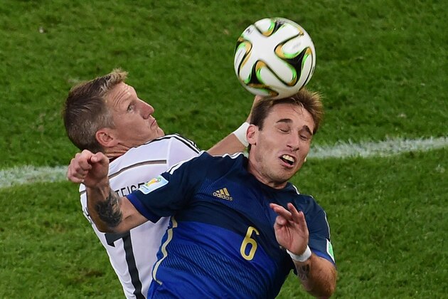 Argentina's Lucas Biglia, right, and Germany's Bastian Schweinsteiger fight for the ball during the World Cup final soccer match between Germany and Argentina at the Maracana Stadium in Rio de Janeiro, Brazil, Sunday, July 13, 2014. (AP Photo/Francois Xavier Marit, Pool) Argentina's Lucas Biglia, right, and Germany's Bastian Schweinsteiger fight for the ball during the World Cup final soccer match between Germany and Argentina at the Maracana Stadium in Rio de Janeiro, Brazil, Sunday, July 13, 2014. (AP Photo/Francois Xavier Marit, Pool)