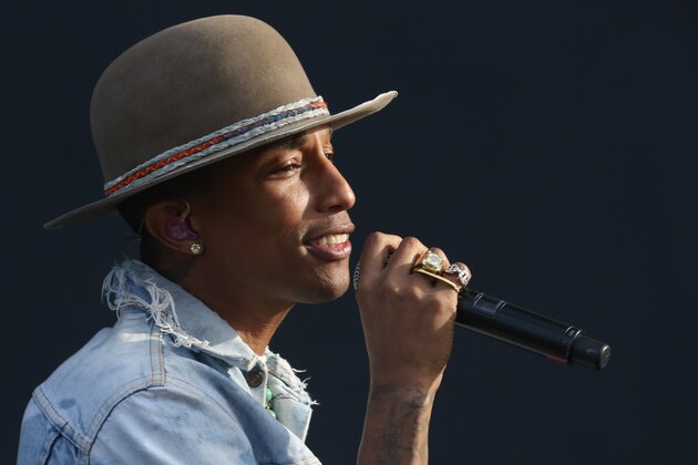 Pharrell Williams performs on the main stage at Wireless festival in Finsbury Park, north London, Friday, July 4, 2014. The first festival took place in June 2005 and was staged in Hyde Park. (Photo by Joel Ryan/Invision/AP)