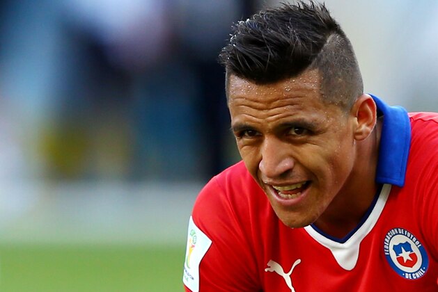 BELO HORIZONTE, BRAZIL - JUNE 28: Alexis Sanchez of Chile looks on at the end of full time during the 2014 FIFA World Cup Brazil round of 16 match between Brazil and Chile at Estadio Mineirao on June 28, 2014 in Belo Horizonte, Brazil.  (Photo by Quinn Rooney/Getty Images)