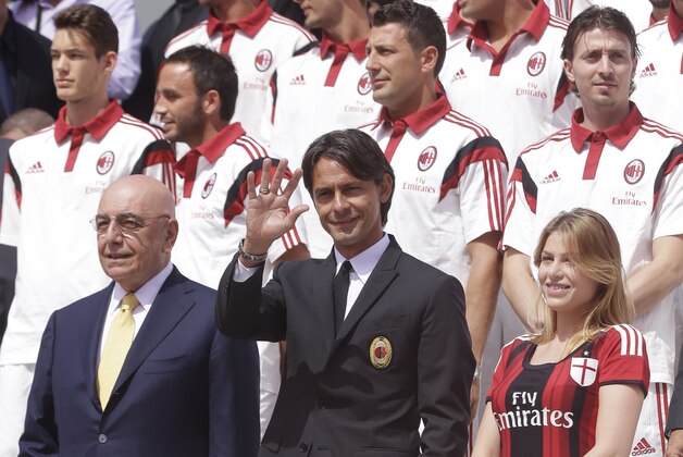 AC Milan coach Filippo Inzaghi, center, poses flanked by AC Milan vice president Barbara Berlusconi, right, and vice president Adriano Galliani during the presentation of the upcoming 2014-15 season at the AC Milan headquarter in Milan, Italy, Thursday, July 10, 2014. (AP Photo/Luca Bruno) AC Milan coach Filippo Inzaghi, center, poses flanked by AC Milan vice president Barbara Berlusconi, right, and vice president Adriano Galliani during the presentation of the upcoming 2014-15 season at the AC Milan headquarter in Milan, Italy, Thursday, July 10, 2014. (AP Photo/Luca Bruno)