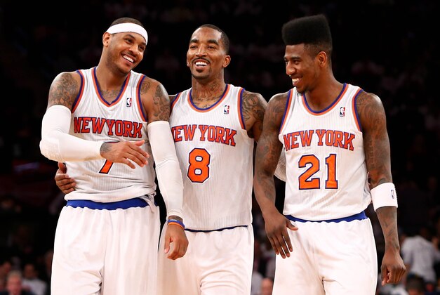 Mar. 27, 2013; New York, NY, USA; New York Knicks small forward Carmelo Anthony (7), shooting guard J.R. Smith (8) and small forward Iman Shumpert (21) smile on the court against the Memphis Grizzlies during the second half at Madison Square Garden. Knicks won 108-101. Mandatory Credit: Debby Wong-USA TODAY Sports