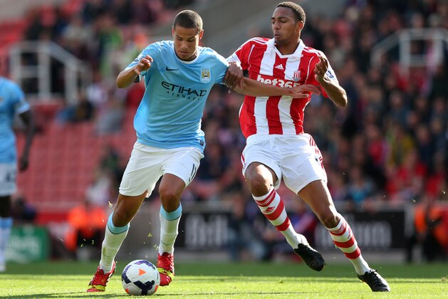 STOKE ON TRENT, ENGLAND - SEPTEMBER 14:  Jack Rodwell of Manchester City is tackled by Steven Nzonzi of Stoke City during the Barclays Premier League match between Stoke City and Manchester City at Britannia Stadium on September 14, 2013 in Stoke on Trent, England.  (Photo by Alex Livesey/Getty Images)
