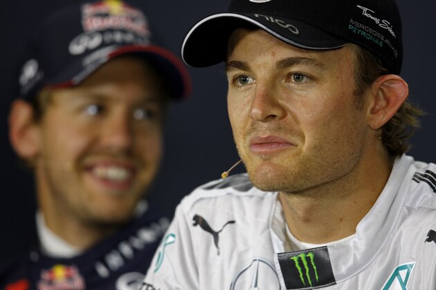 NORTHAMPTON, ENGLAND - JULY 05:  Nico Rosberg of Germany and Mercedes GP speaks next to Sebastian Vettel of Germany and Infiniti Red Bull Racing during a press conference following qualifying ahead of the British Formula One Grand Prix at Silverstone Circuit on July 5, 2014 in Northampton, United Kingdom.  (Photo by Drew Gibson/Getty Images)