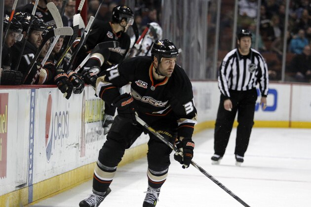 Anaheim Ducks right wing Daniel Winnik (34) handles the puck in the second period of an NHL hockey game against Minnesota Wild Wednesday, Dec. 11, 2013 in Anaheim, Calif.   (AP Photo/Alex Gallardo)
