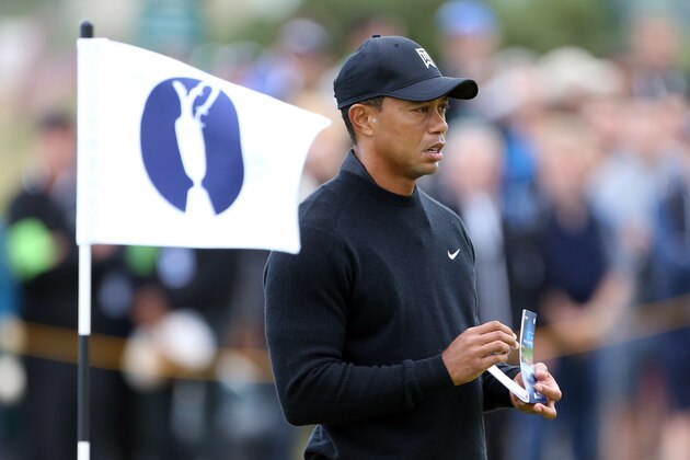 Tiger Woods of the US holds his scorecard after putting on the 11th green during a practice round ahead of the British Open Golf championship at the Royal Liverpool golf club, Hoylake, England, Tuesday July 15, 2014. The British Open Golf championship starts on Thursday July 17. (AP Photo/Peter Morrison) Tiger Woods of the US holds his scorecard after putting on the 11th green during a practice round ahead of the British Open Golf championship at the Royal Liverpool golf club, Hoylake, England, Tuesday July 15, 2014. The British Open Golf championship starts on Thursday July 17. (AP Photo/Peter Morrison)
