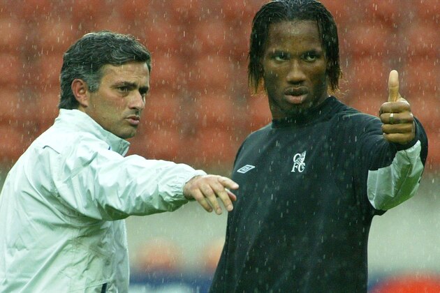 Chelsea's coach Jose Mourinho, left, and striker Didier Drogba, right, gesture during a training session in Paris, Monday Sept. 13, 2004. Chelsea are preparing for the Champions Leagues soccer match against Paris Saint Germain, Tuesday Sept. 14.(AP Photo/Michel Euler) Chelsea's coach Jose Mourinho, left, and striker Didier Drogba, right, gesture during a training session in Paris, Monday Sept. 13, 2004. Chelsea are preparing for the Champions Leagues soccer match against Paris Saint Germain, Tuesday Sept. 14.(AP Photo/Michel Euler)