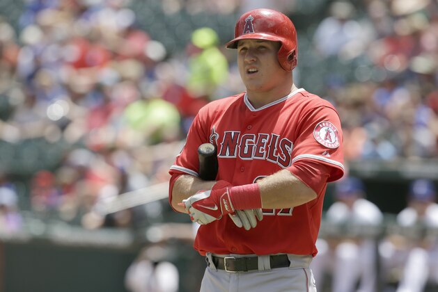 Los Angeles Angels Mike Trout (27) prepares to ball during the baseball game against the Texas Rangers in Arlington, Texas, Sunday, July 13, 2014. (AP Photo/LM Otero)