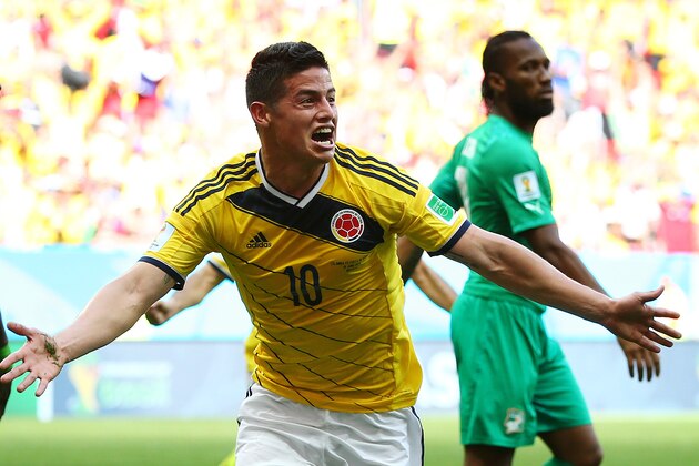 BRASILIA, BRAZIL - JUNE 19: James Rodriguez of Colombia celebrates after scoring his team's first goal during the 2014 FIFA World Cup Brazil Group C match between Colombia and Cote D'Ivoire at Estadio Nacional on June 19, 2014 in Brasilia, Brazil.  (Photo by Elsa/Getty Images)