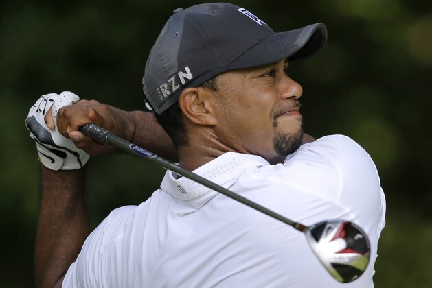 Tiger Woods tees off on the 14th hole during the second round of the Quicken Loans National PGA golf tournament, Friday, June 27, 2014, in Bethesda, Md. (AP Photo/Patrick Semansky)