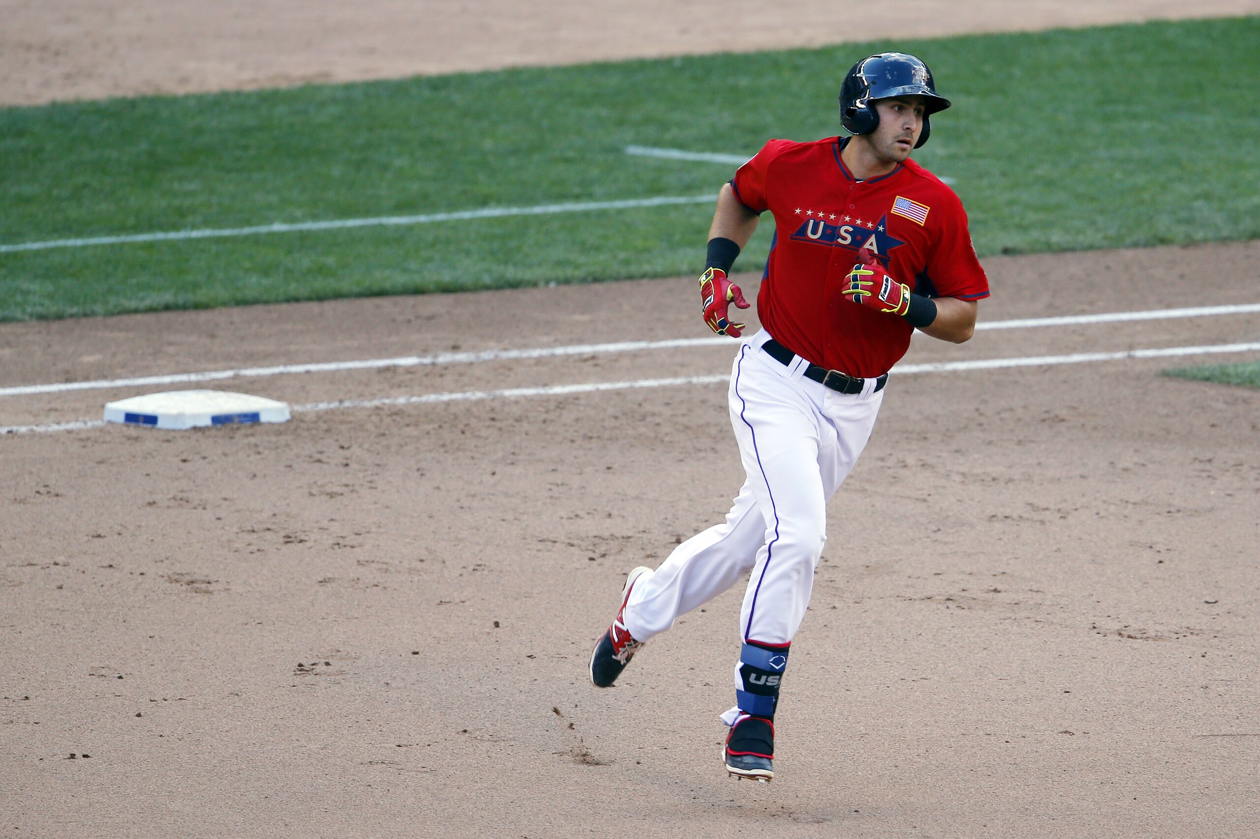 United States' Joey Gallo runs the bases after hitting a two-run home run during the sixth inning of the All-Star Futures baseball game against the World Team, Sunday, July 13, 2014, in Minneapolis. (AP Photo/Paul Sancya)