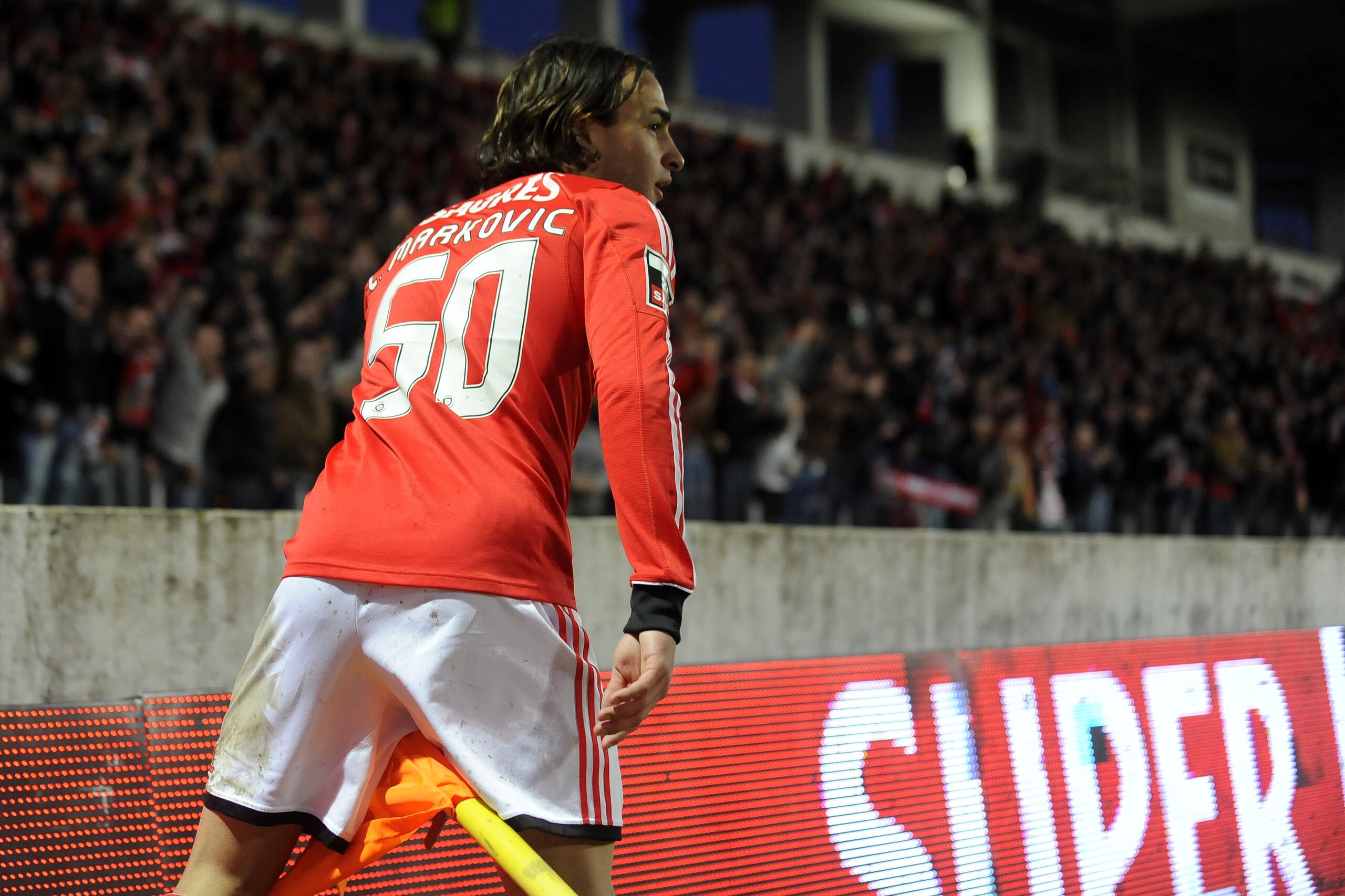 Benfica's Lazar Markovic, from Serbia, celebrates after scoring his side's second goal against Pacos Ferreira in a Portuguese League soccer match at Mata Real stadium in Pacos de Ferreira, northern Portugal, Sunday, Feb. 16, 2014. (AP Photo/Paulo Duarte)