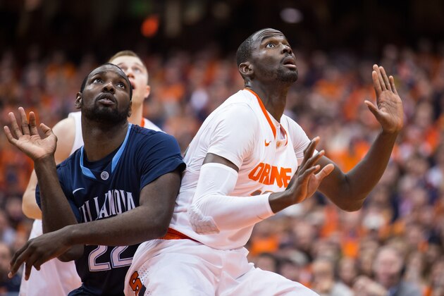 SYRACUSE, NY - DECEMBER 28:  Baye Moussa Keita #12 of the Syracuse Orange boxes out JayVaughn Pinkston #22 of the Villanova Wildcats following a free throw attempt in the second half on December 28, 2013 at The Carrier Dome in Syracuse, New York.  (Photo by Brett Carlsen/Getty Images)