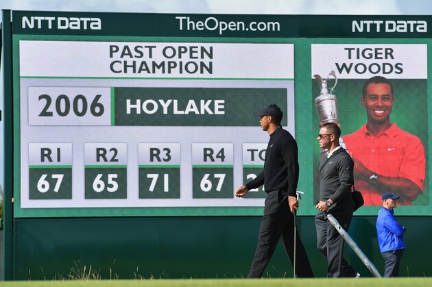 HOYLAKE, ENGLAND - JULY 15:  Tiger Woods of the United States chats with his instructor Sean Foley during a practice round prior to the start of The 143rd Open Championship at Royal Liverpool on July 15, 2014 in Hoylake, England.  (Photo by Stuart Franklin/Getty Images)
