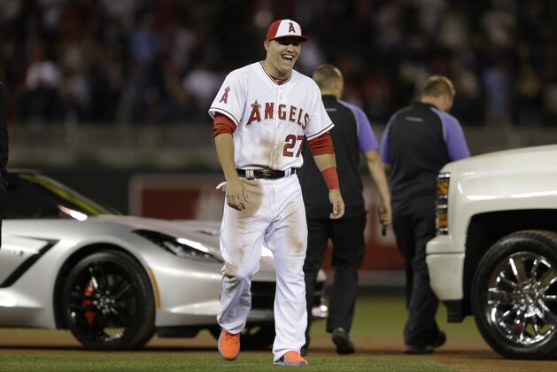 American League's Mike Trout, of the Los Angeles Angels, reacts after winning the MVP Award at the MLB All-Star baseball game, Tuesday, July 15, 2014, in Minneapolis.  (AP Photo/Jeff Roberson)
