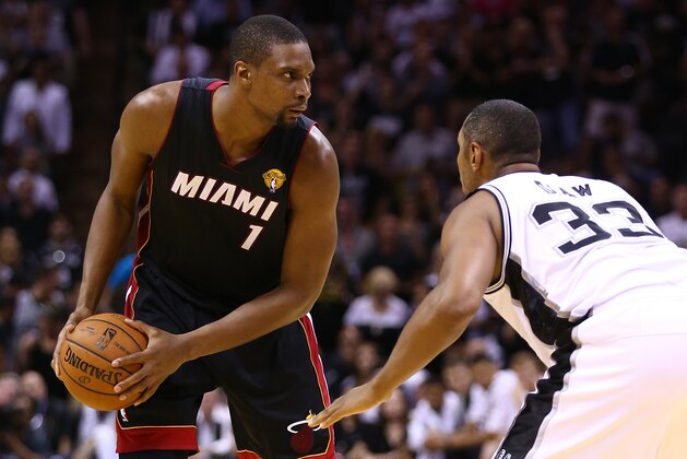 SAN ANTONIO, TX - JUNE 15: Chris Bosh #1 of the Miami Heat looks to pass as Boris Diaw #33 of the San Antonio Spurs defends during Game Five of the 2014 NBA Finals at the AT&T Center on June 15, 2014 in San Antonio, Texas. NOTE TO USER: User expressly acknowledges and agrees that, by downloading and or using this photograph, User is consenting to the terms and conditions of the Getty Images License Agreement. (Photo by Andy Lyons/Getty Images) SAN ANTONIO, TX - JUNE 15: Chris Bosh #1 of the Miami Heat looks to pass as Boris Diaw #33 of the San Antonio Spurs defends during Game Five of the 2014 NBA Finals at the AT&T Center on June 15, 2014 in San Antonio, Texas. NOTE TO USER: User expressly acknowledges and agrees that, by downloading and or using this photograph, User is consenting to the terms and conditions of the Getty Images License Agreement. (Photo by Andy Lyons/Getty Images)