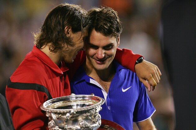 MELBOURNE, AUSTRALIA - FEBRUARY 01:  Rafael Nadal of Spain consoles Roger Federer of Switzerland during the trophy presentation after his men's final match during day fourteen of the 2009 Australian Open at Melbourne Park on  February 1, 2009 in Melbourne, Australia.  (Photo by Scott Barbour/Getty Images)