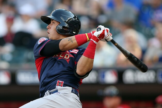 Jul 13, 2014; Minneapolis, MN, USA; World infielder Javier Baez hits a two-run home run in the 6th inning during the All Star Futures Game at Target Field. Mandatory Credit: Jerry Lai-USA TODAY Sports