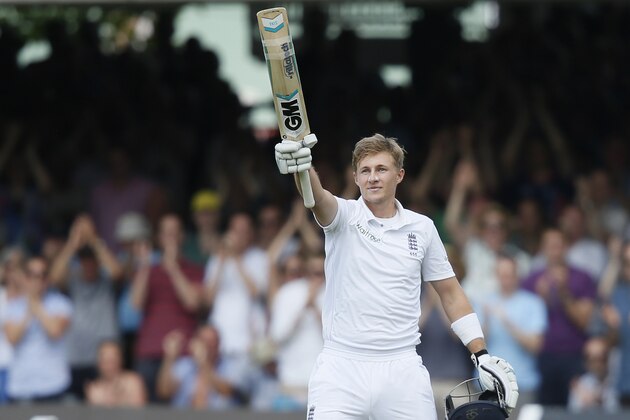 England's Joe Root turns towards his teams dressing room as he celebrates scoring 200 runs not out against Sri Lanka on the second day of the first test cricket match between England and Sri Lanka at Lord's cricket ground in London, Friday, June, 13, 2014. (AP Photo/Alastair Grant)