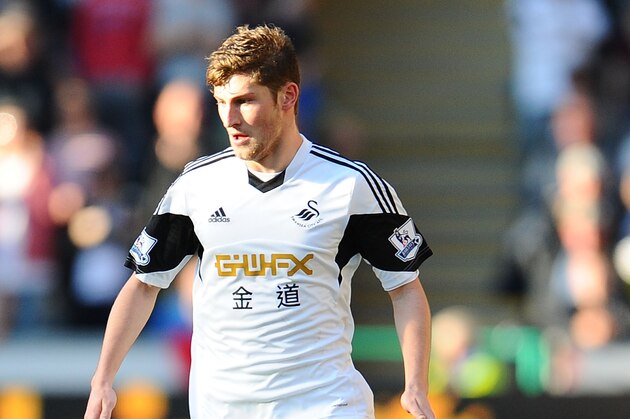 SWANSEA, WALES - MARCH 15: Ben Davies of Swansea City in action during the Barclays Premier League match between Swansea City and West Bromwich Albion at Liberty Stadium on March 15, 2014 in Swansea, Wales. (Photo by Tom Dulat/Getty Images)