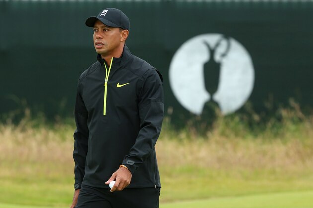 HOYLAKE, ENGLAND - JULY 15:  Tiger Woods of the United States walks across a green during a practice round prior to the start of The 143rd Open Championship at Royal Liverpool on July 15, 2014 in Hoylake, England.  (Photo by Andrew Redington/Getty Images)