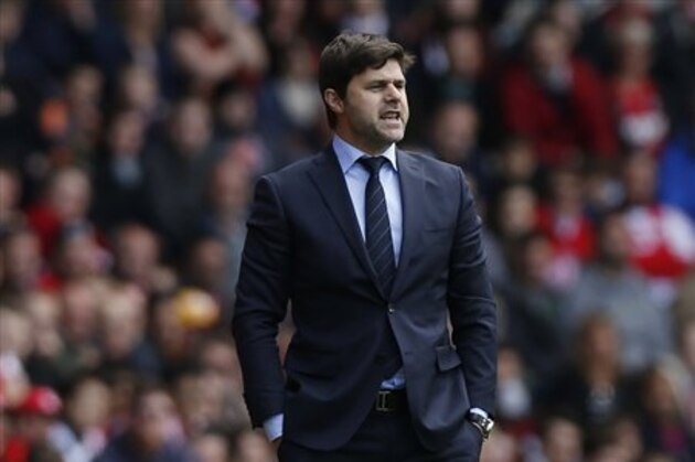 FILE - In this Sunday, May 11, 2014, file photo, Southampton's manager Mauricio Pochettino watches his team play against Manchester United during their English Premier League soccer match at St Mary's stadium, Southampton, England.  Tottenham has hired Mauricio Pochettino as the club's new manager on a five-year contract, with the former Argentina defender making the move from fellow Premier League side Southampton. (AP Photo/Sang Tan, File)