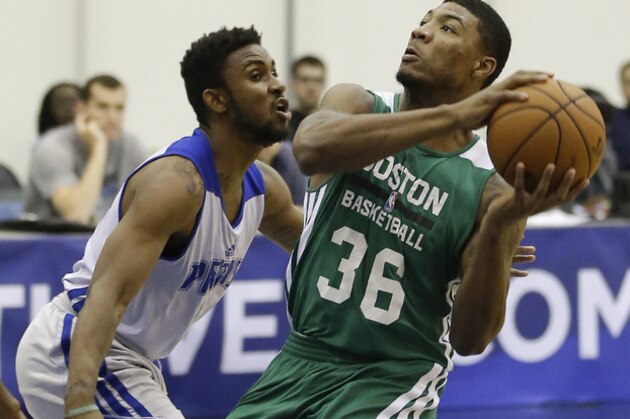 Boston Celtics' Marcus Smart (36) goes to the basket as he is defended by Detroit Pistons' Ian Miller during an NBA summer league basketball game in Orlando, Fla., Wednesday, July 9, 2014. (AP Photo/John Raoux)