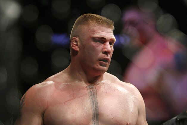 FILE - In this Nov. 15, 2008 file photo, Brock Lesnar reacts during his win over Randy Couture for the UFC World Heavyweight Mixed Martial Arts championship match  in Las Vegas.  Lesnar won by TKO in the second round.   Lesnar has withdrawn from his upcoming title defense against Shane Carwin because of an illness.  Lesnar was scheduled to fight Carwin in the main event of UFC 106 on Nov. 21 at the Mandalay Bay Events Center in Las Vegas.  (AP Photo/Eric Jamison)