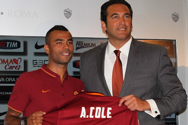 ROME, ITALY - JULY 15:  (L-R) New signing Ashley Cole and AS Roma Ceo Italo Zanzi pose for photographs with AS Roma Shirt during the press conference at the AS Roma Training Centre on July 15, 2014 in Rome, Italy.  (Photo by Paolo Bruno/Getty Images)