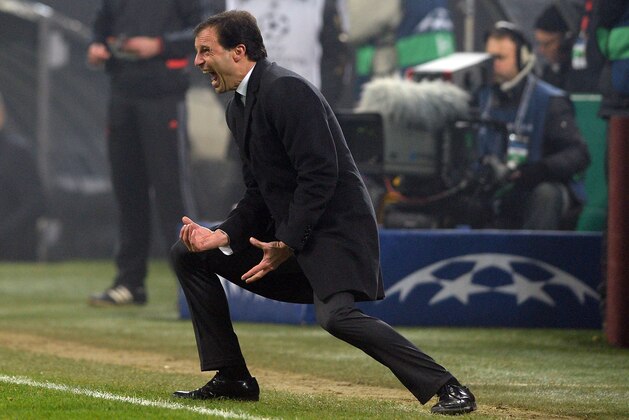 MILAN, ITALY - DECEMBER 11:  Head coach AC Milan Massimiliano Allegri reacts during the UEFA Champions League Group H match between AC Milan and Ajax Amsterdam at Stadio Giuseppe Meazza on December 11, 2013 in Milan, Italy.  (Photo by Claudio Villa/Getty Images)
