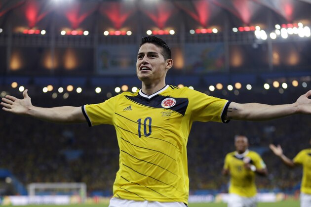 FILE - In this June 28, 2014, file photo, Colombia's James Rodriguez celebrates after scoring the opening goal during the World Cup round of 16 soccer match between Colombia and Uruguay at the Maracana Stadium in Rio de Janeiro, Brazil. Never before has the star-crossed nation made the quarterfinals. There is even waxing poetic about World Cup unity accelerating the pace of 18-month-old peace talks to end a half-century of conflict that has claimed some 220,000 lives. (AP Photo/Natacha Pisarenko)