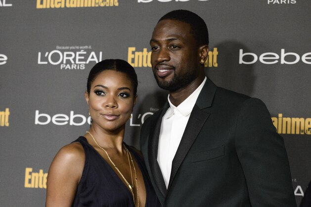 Actress Gabrielle Union, left, and NBA player Dwyane Wade arrive at the 2013 Entertainment Weekly Pre-Emmy Party at Fig & Olive on Friday, Sept. 20, 2013 in Los Angeles. (Photo by Dan Steinberg/Invision/AP)